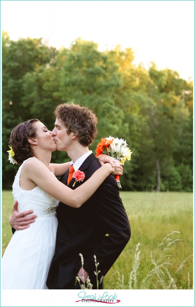 kissing in a field