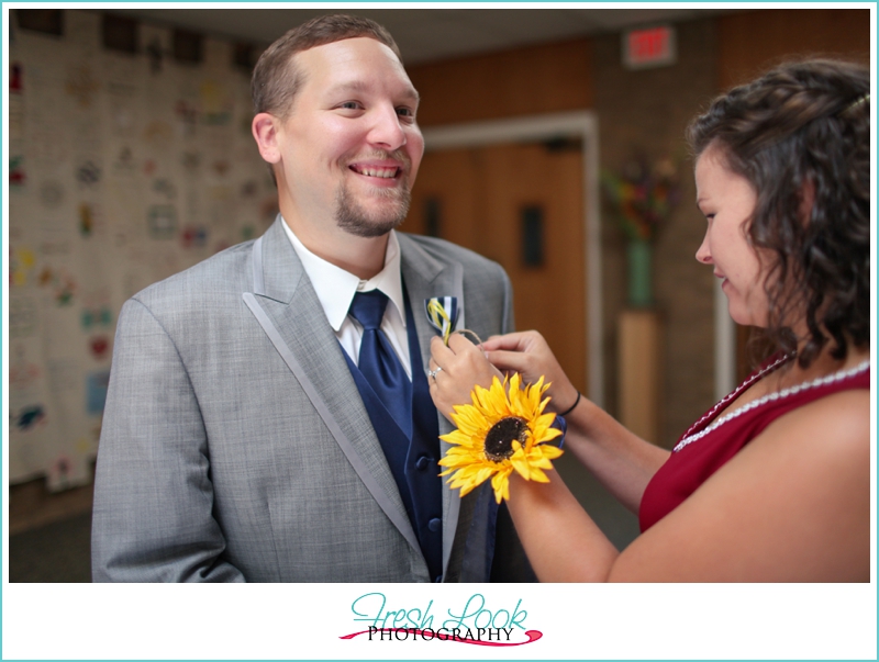pinning the boutonniere 