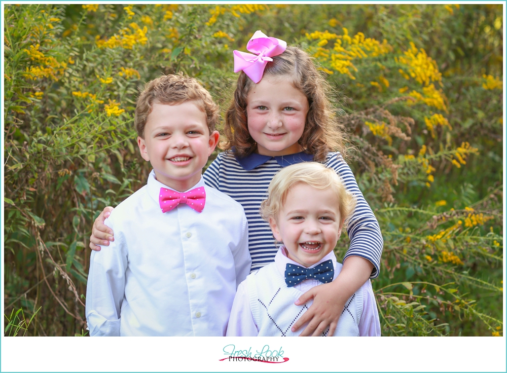 three little kids smiling