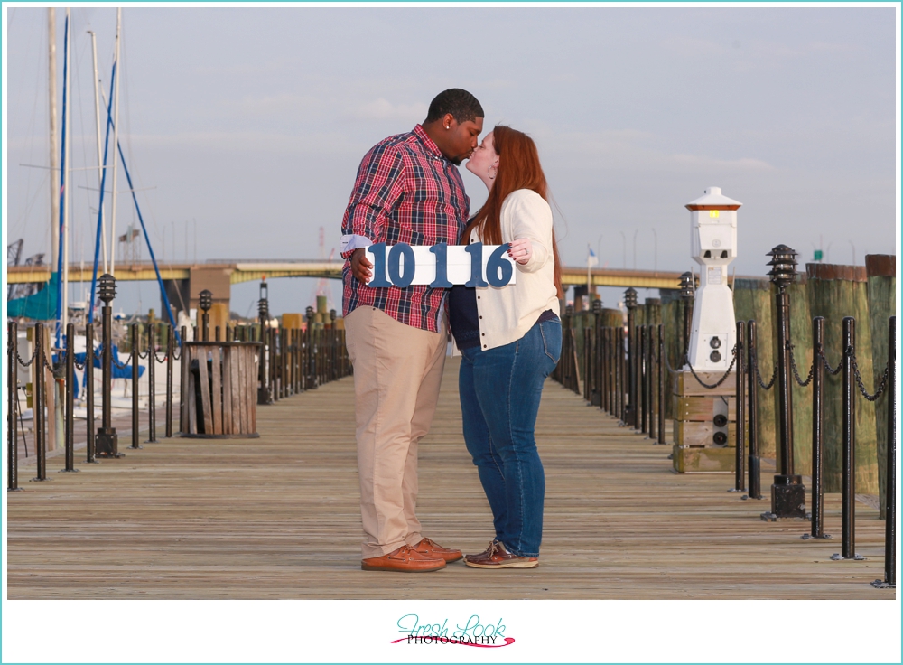 couple kissing on the pier
