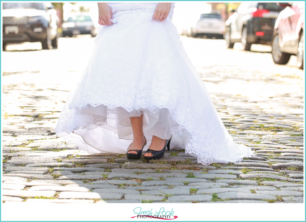 showing off blue wedding shoes