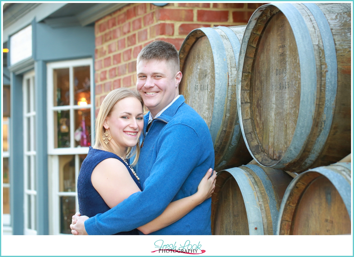 wine barrels in engagement shoot