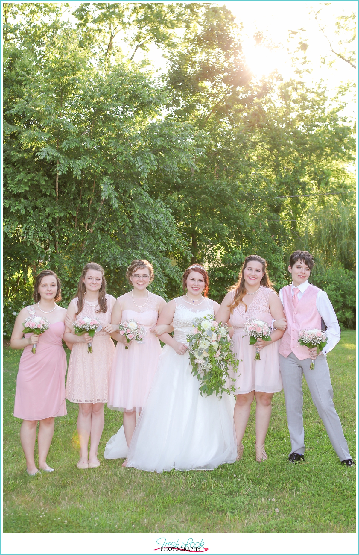bridesmaids wearing blush dresses