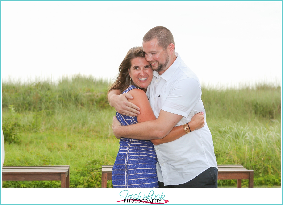 bride and groom hugging