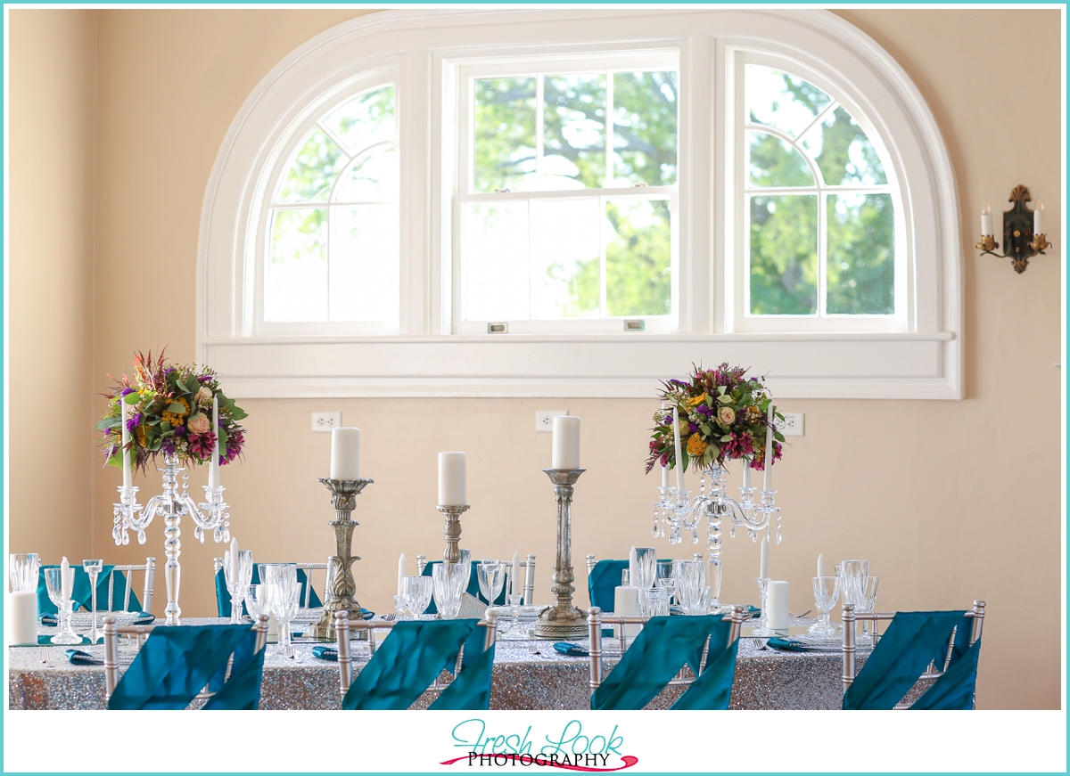 reception table with teal sparkles
