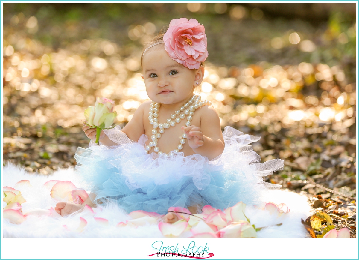 little girl wearing pearls