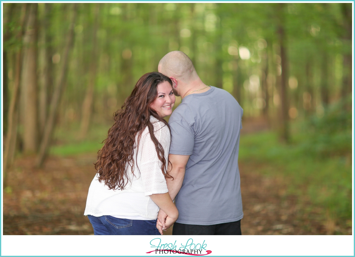 flirty woodsy engagement shoot