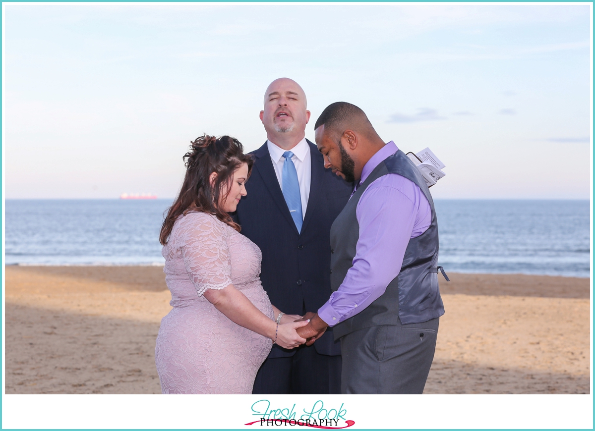 bride and groom praying