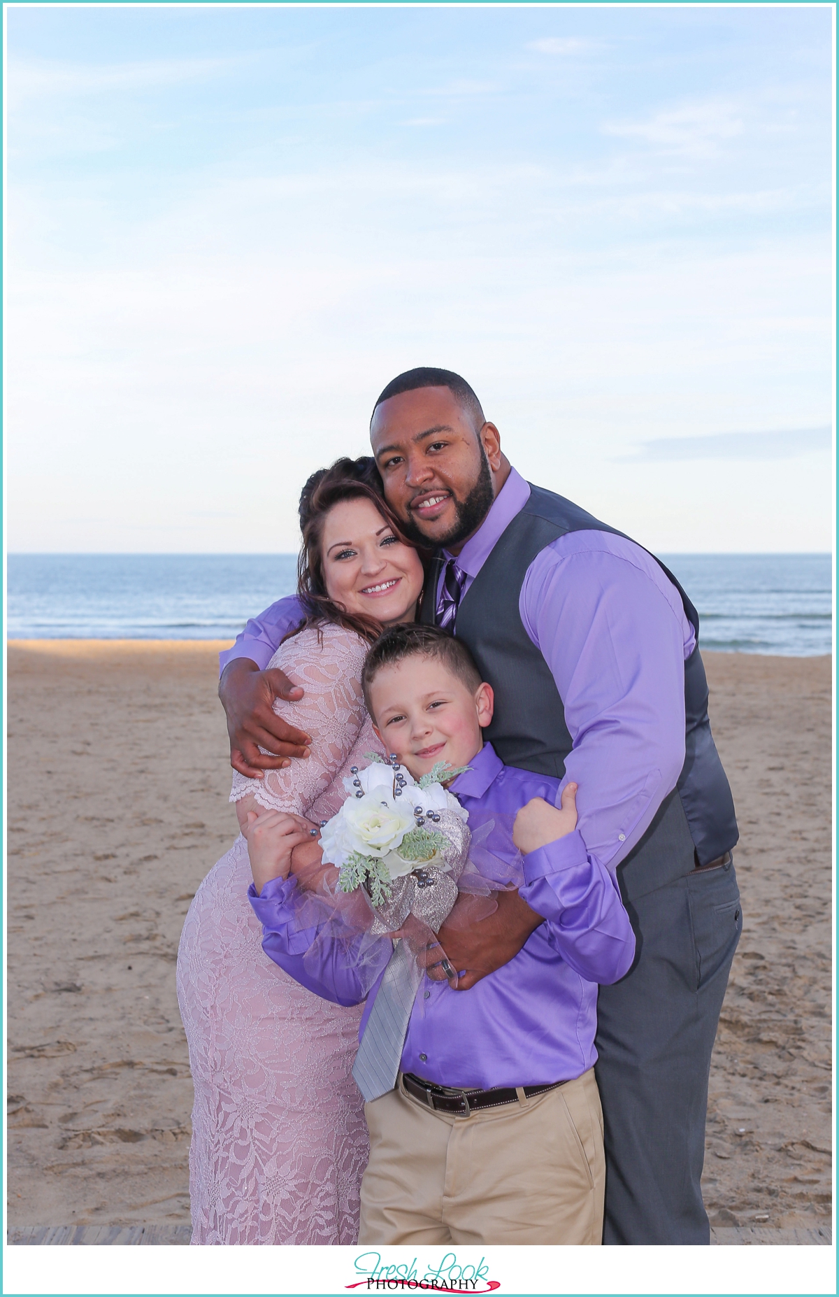 bride and groom with son