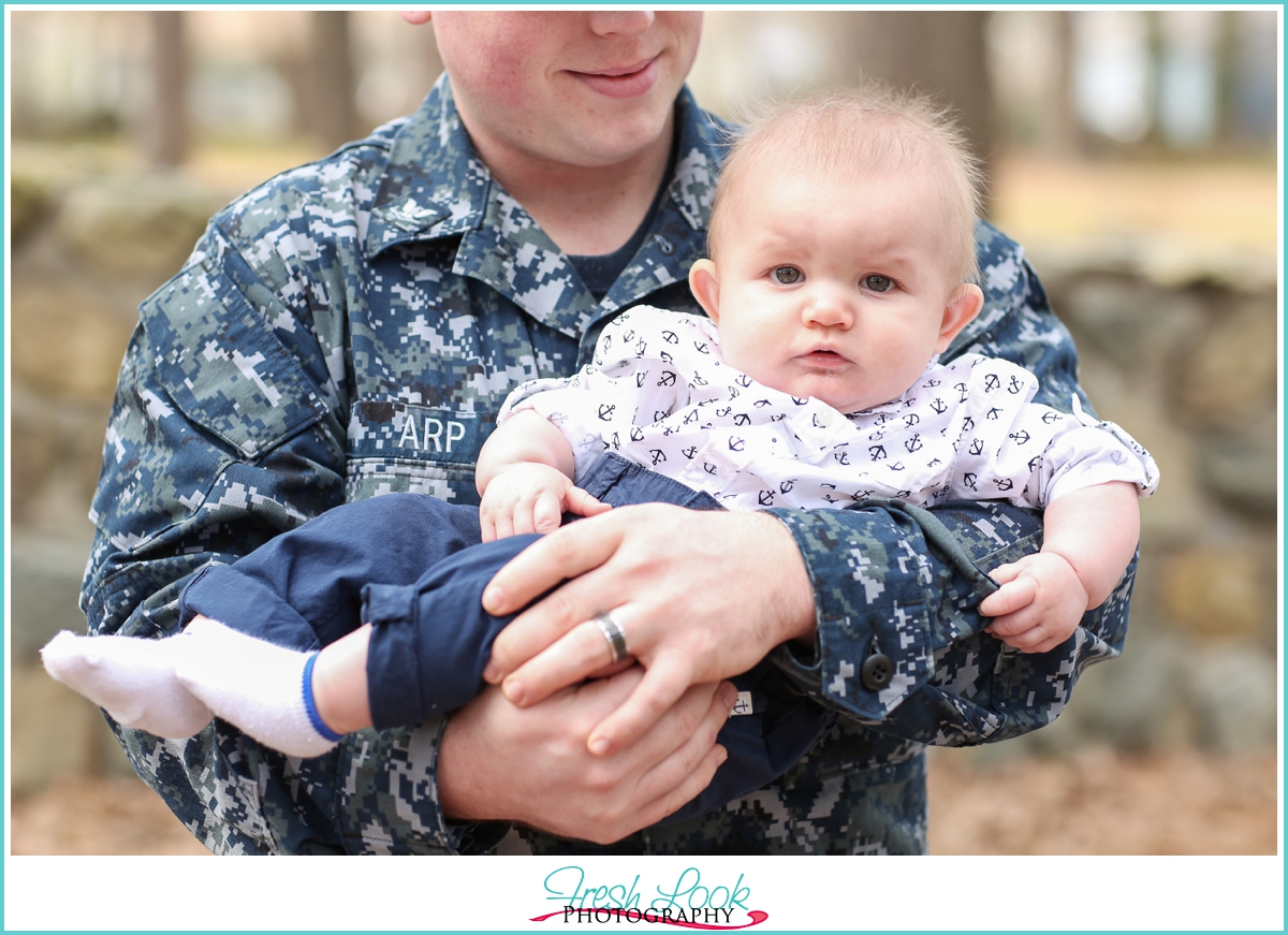 daddy holding his baby