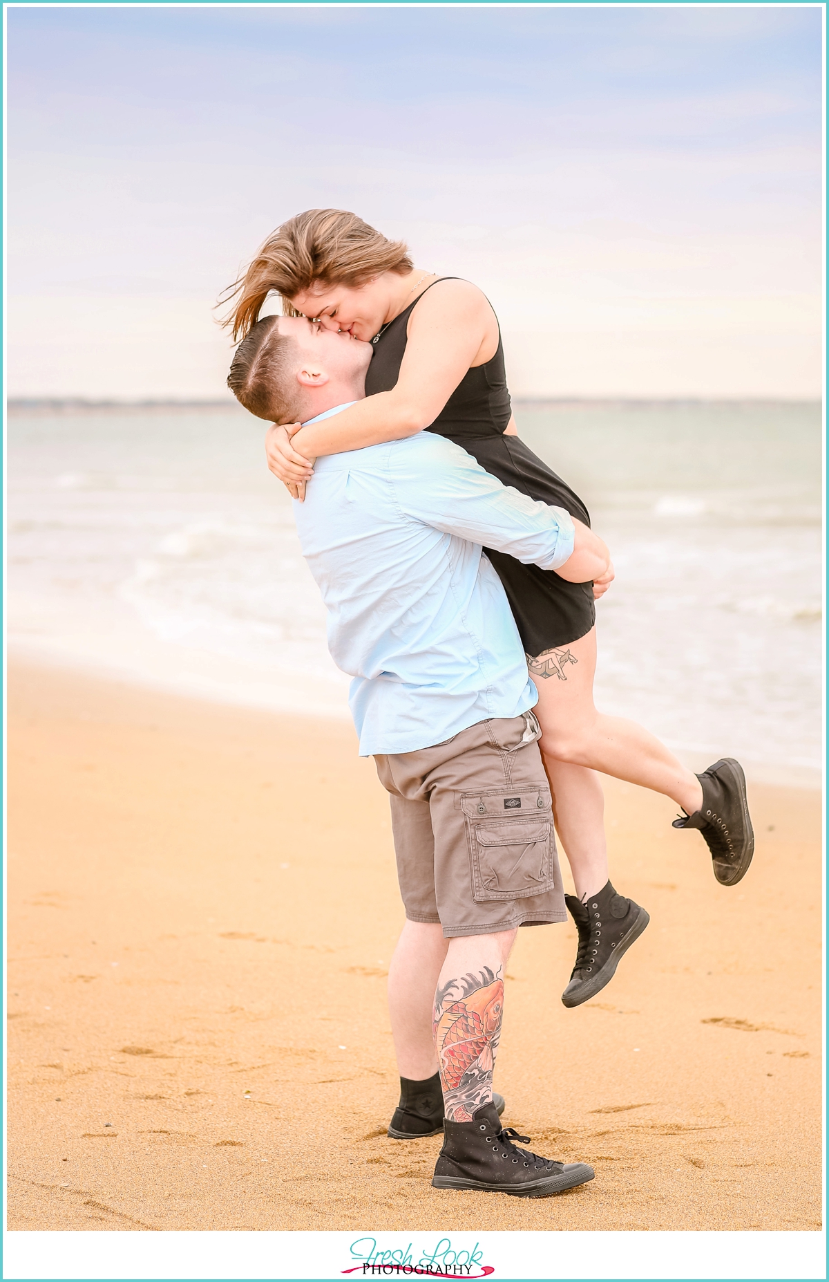 playful beach engagement photos