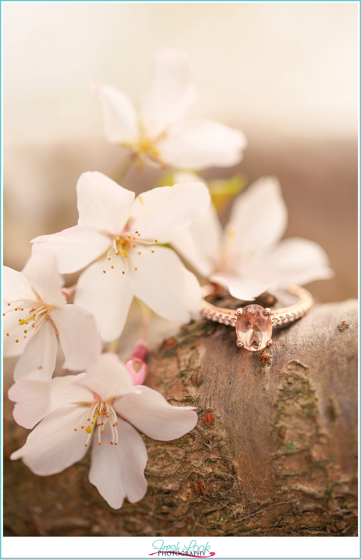 cherry blossoms and oval engagement ring