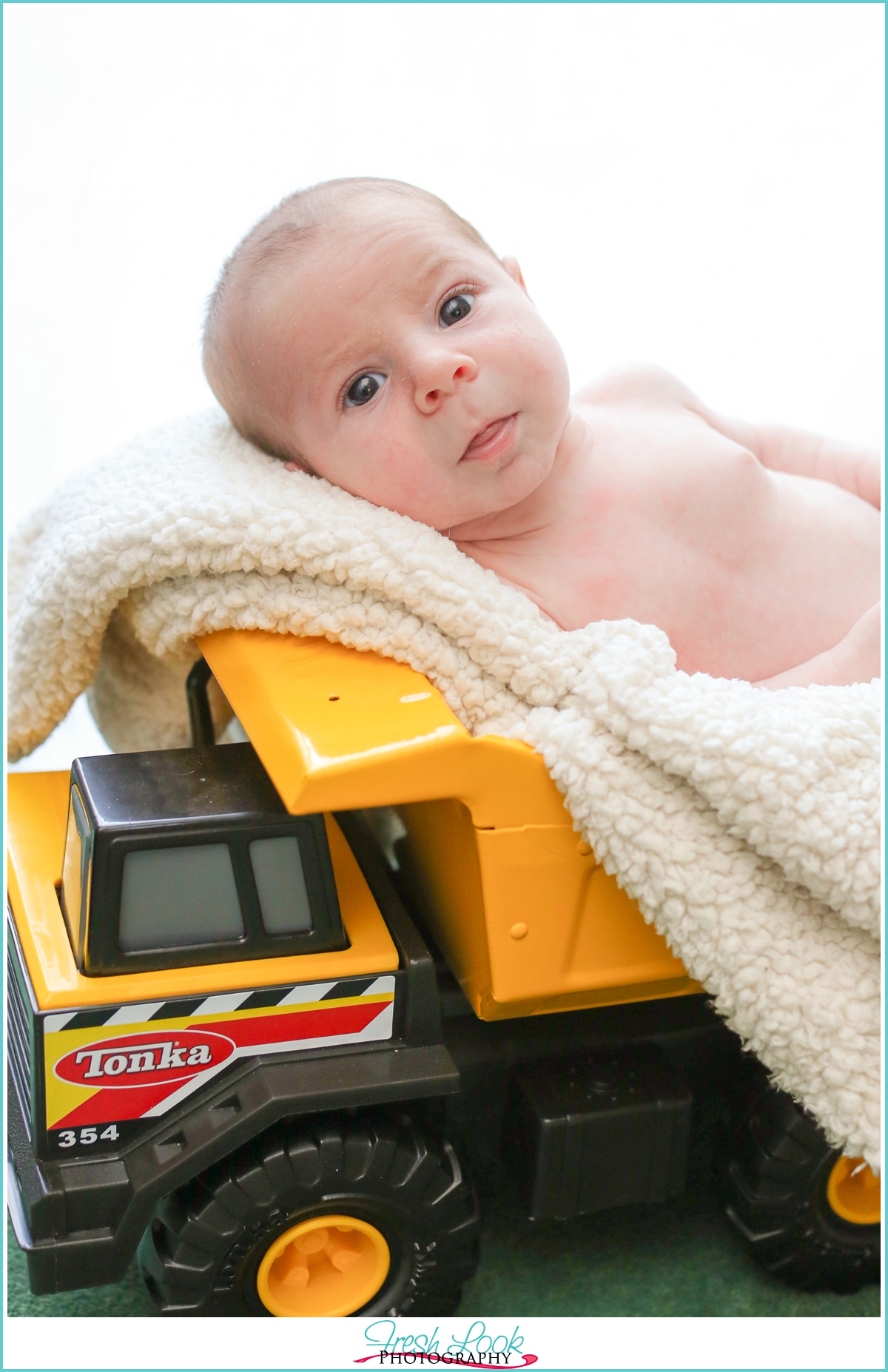 newborn baby in Tonka Truck