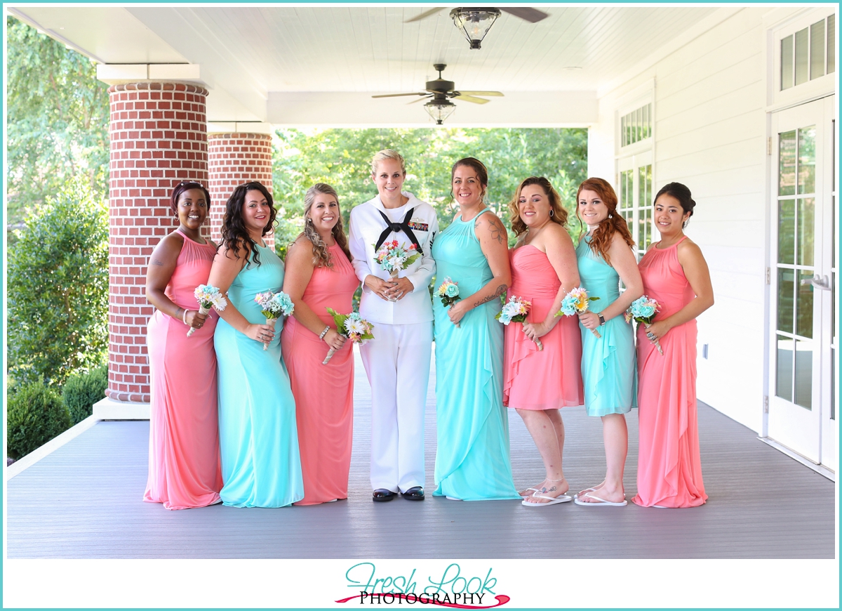 bride and bridesmaids wearing teal and coral 