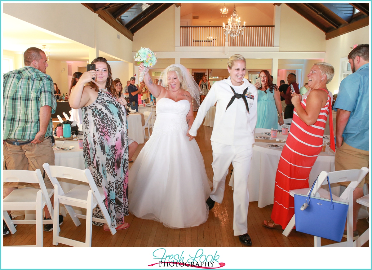 bride and bride entering reception