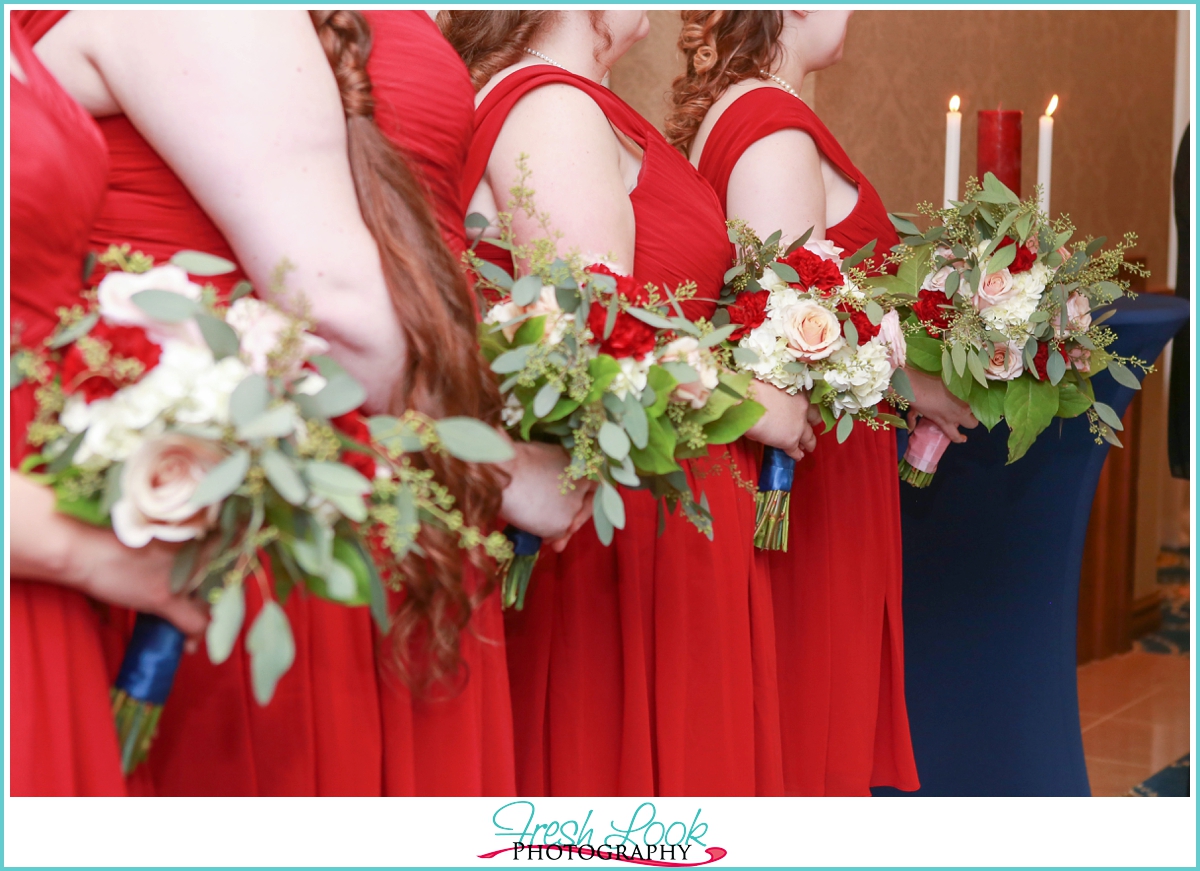 bridesmaids in red dresses