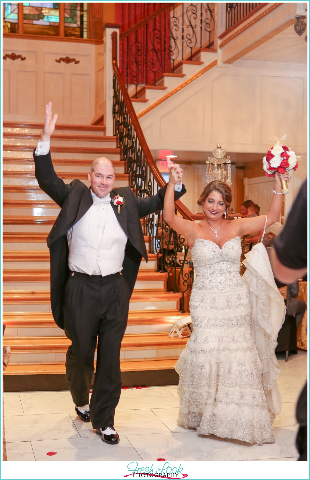 bride and groom entering reception