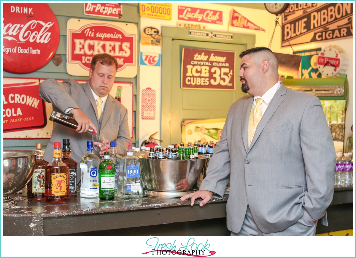 groom getting a drink at the bar