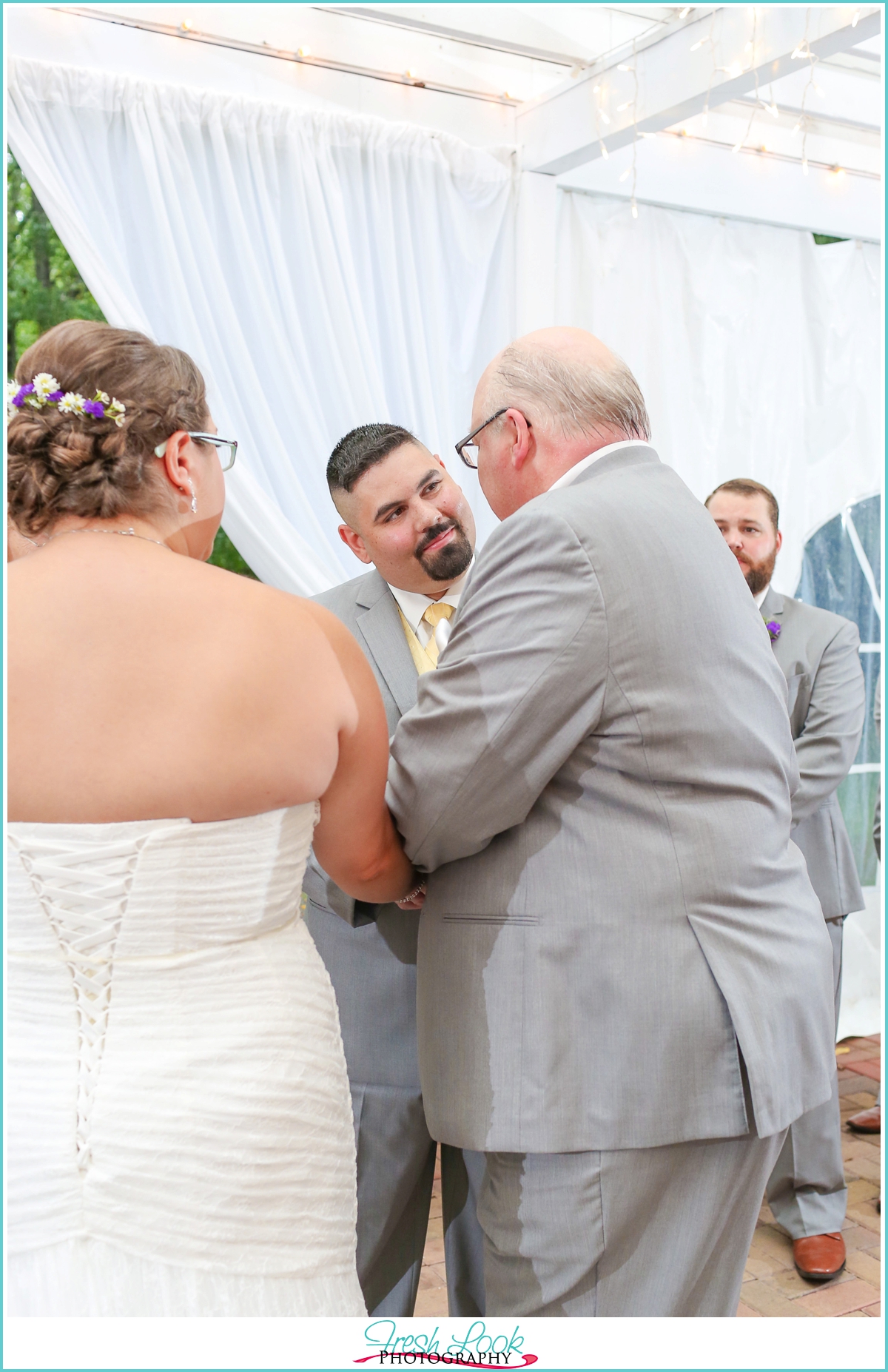 handing the bride to her groom