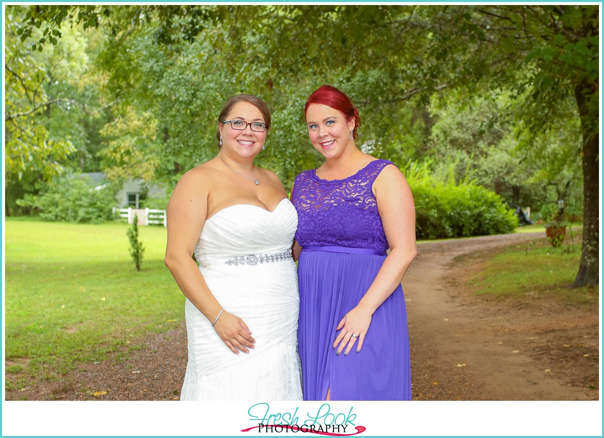 bride and bridesmaid wearing purple