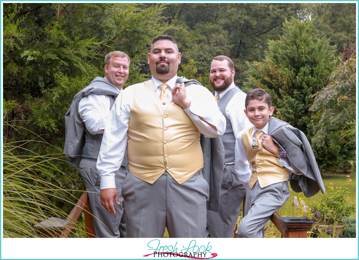 classy groomsmen posing outdoors