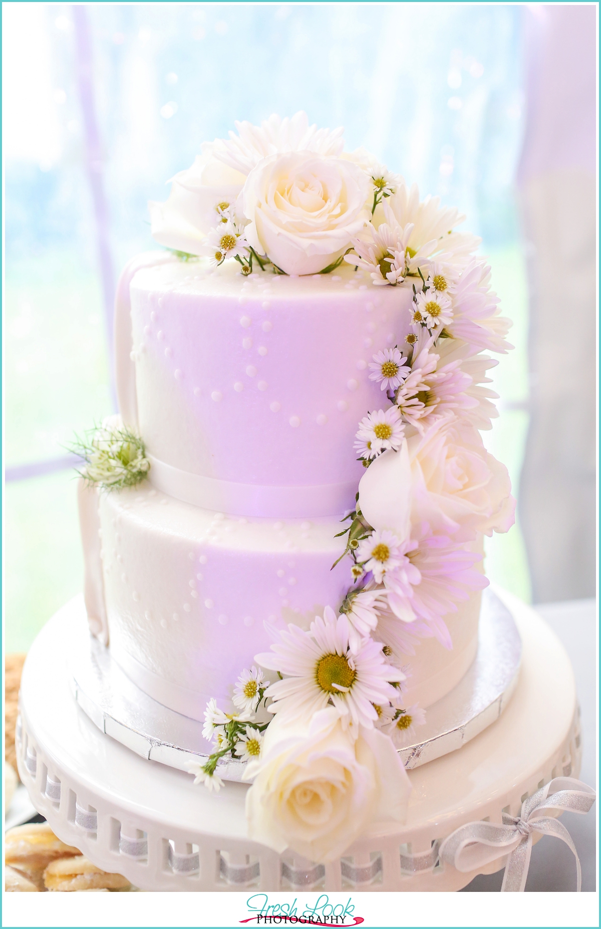 wedding cake with white roses