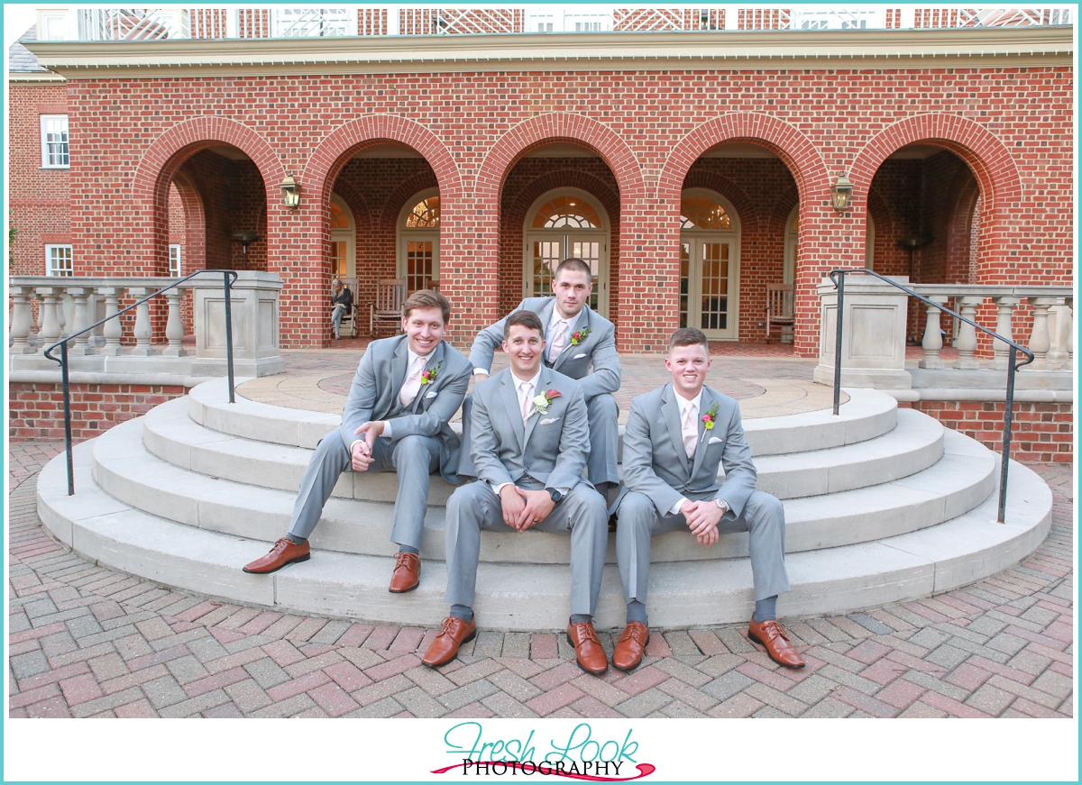 Groomsmen posing on the steps