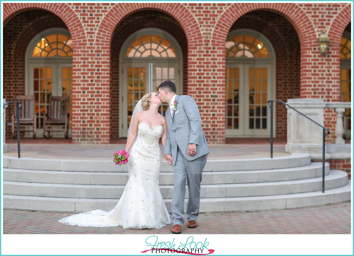 Bride and groom kissing at the wedding