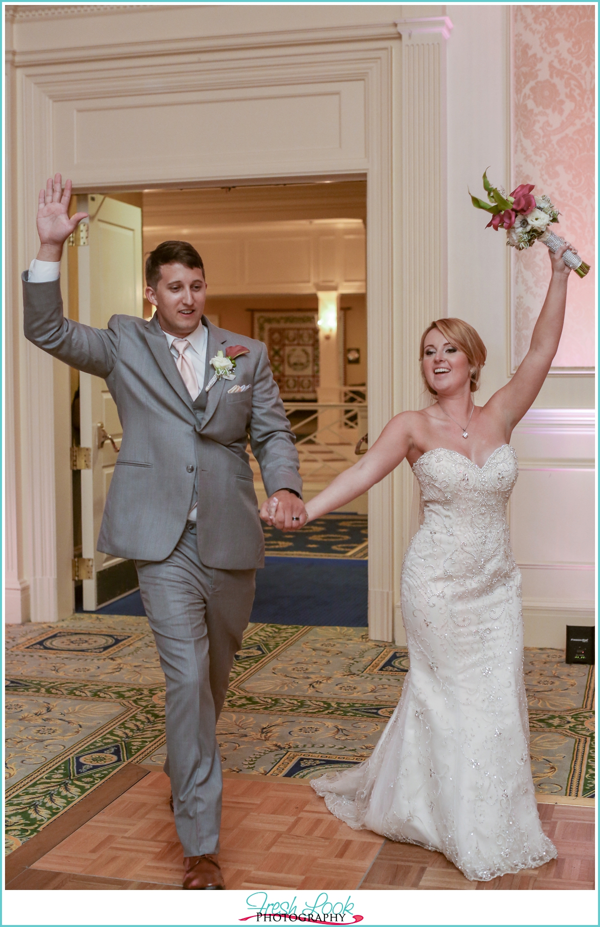 Bride and groom entering reception