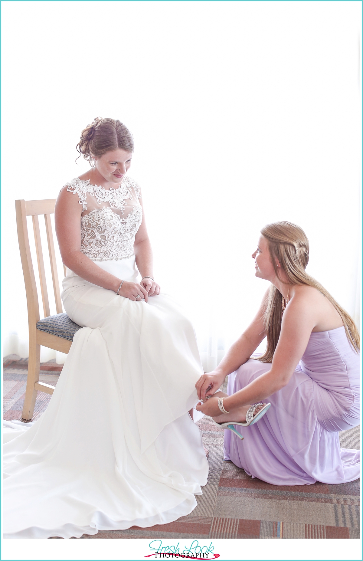 bride putting shoes on 