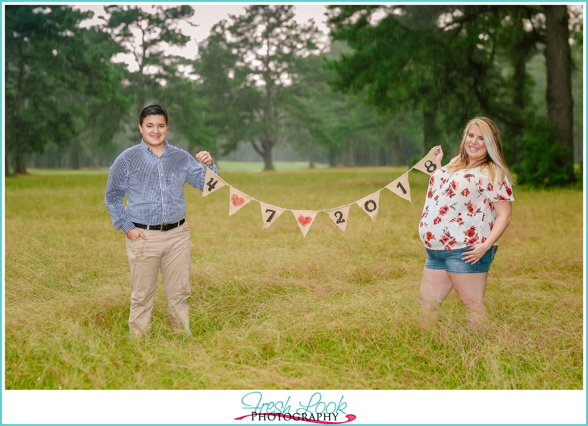 we're getting married burlap sign