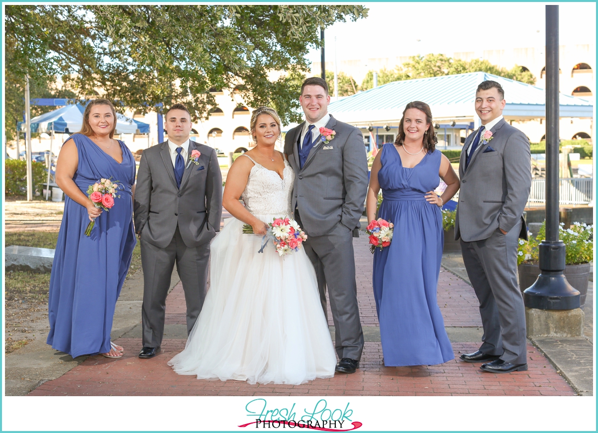 bridal party wearing blue and gray
