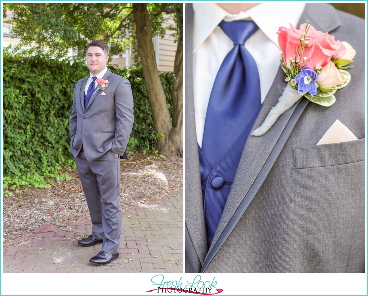 groom wearing gray suit and blue vest