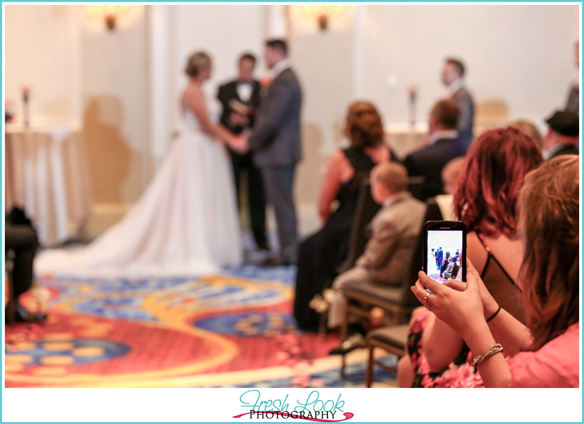 snapping a picture of the wedding