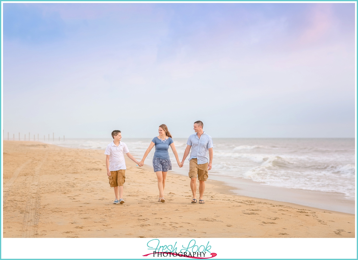 walking hand in hand on the beach