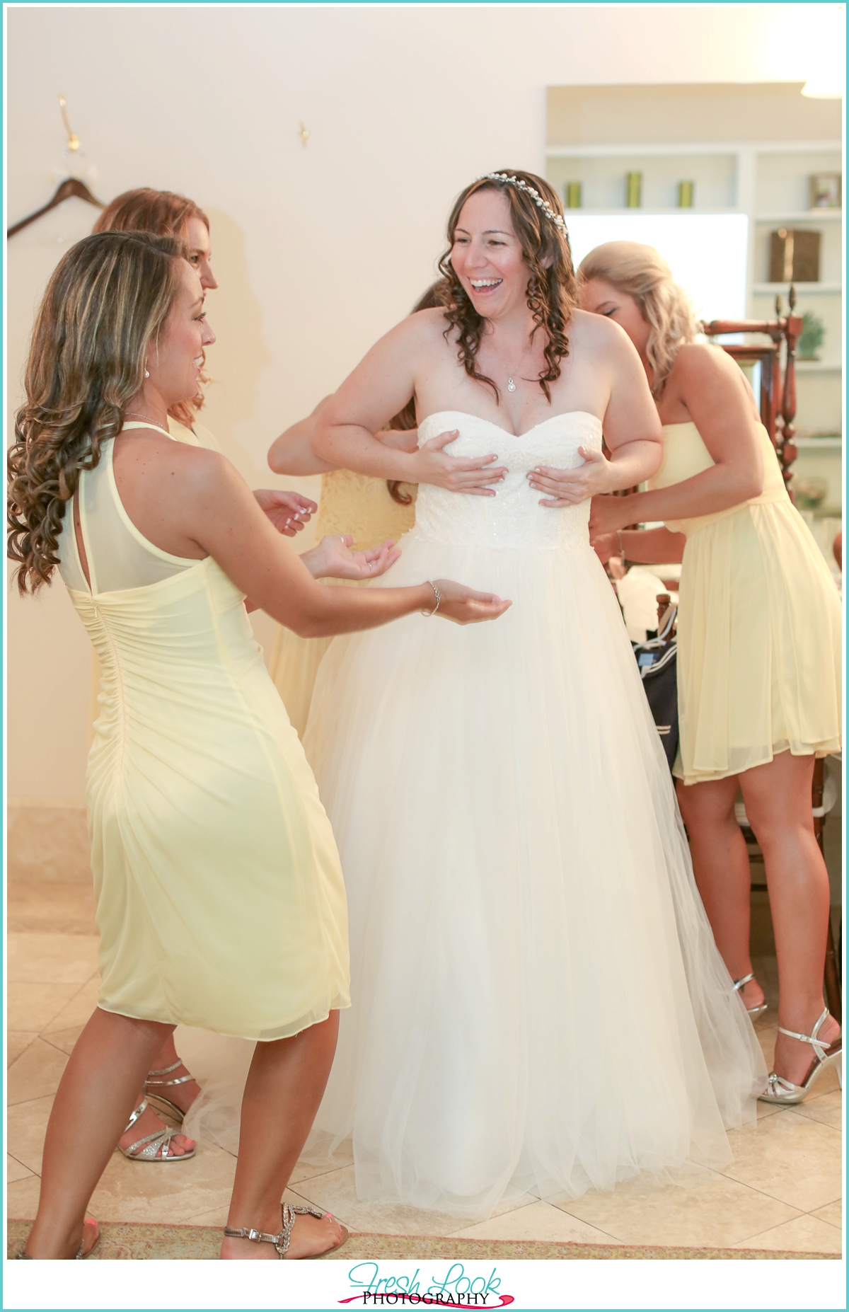 bridesmaids helping the bride