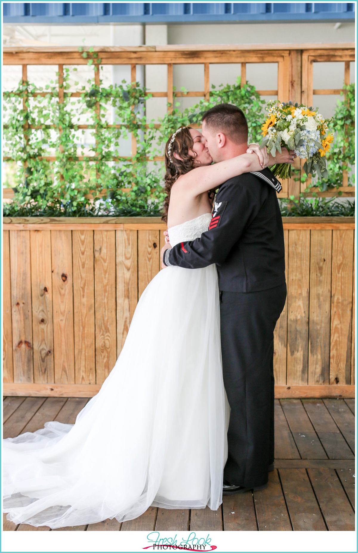 bride and groom first kiss