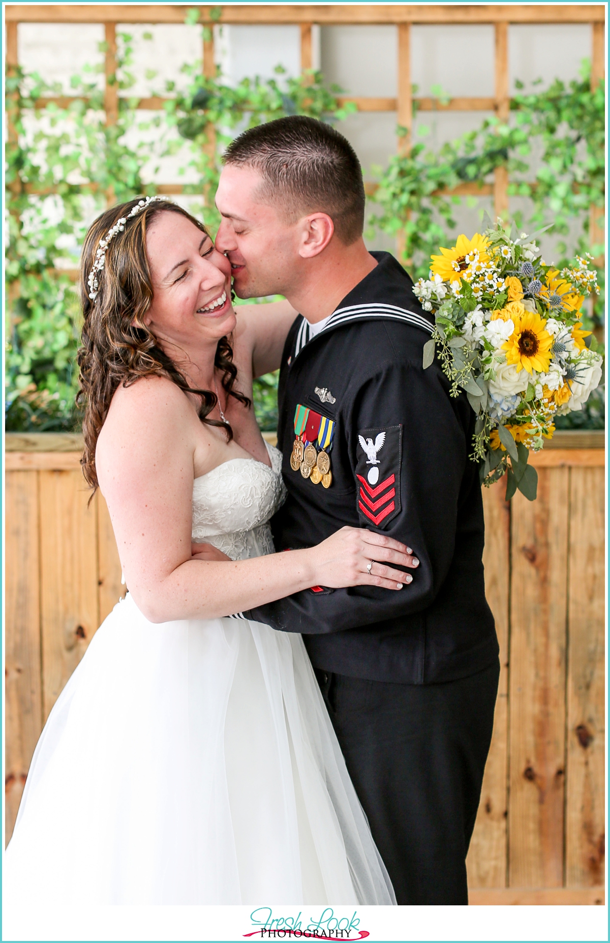 bride and groom snuggling and laughing