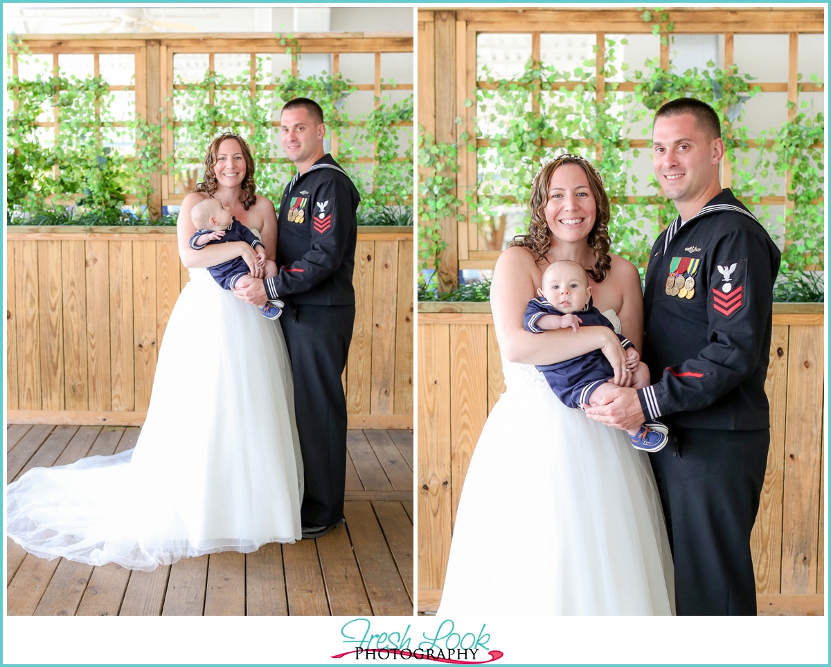 bride and groom with their baby