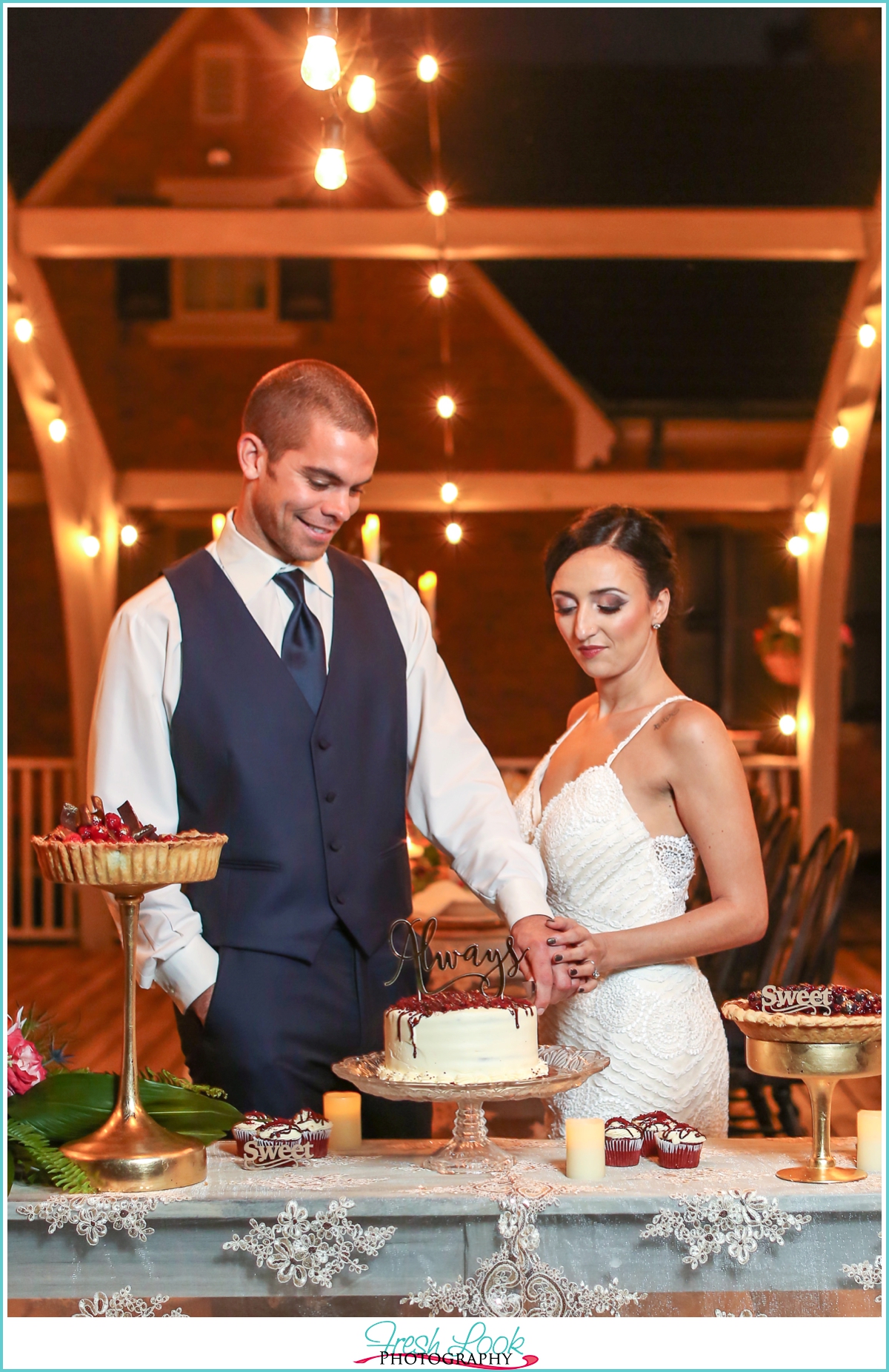 Mr and Mrs cutting the cake