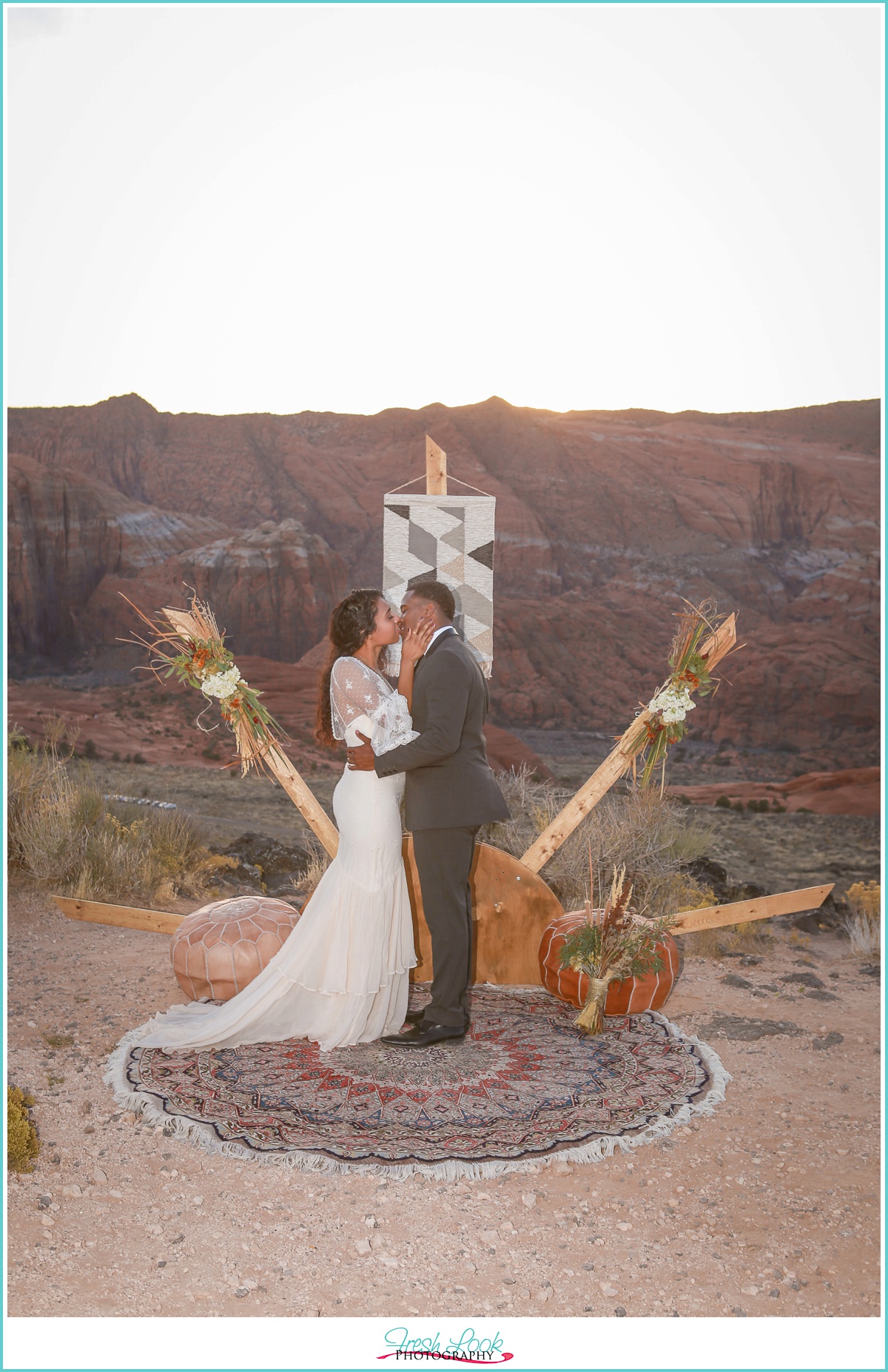 romantic bride and groom first kiss