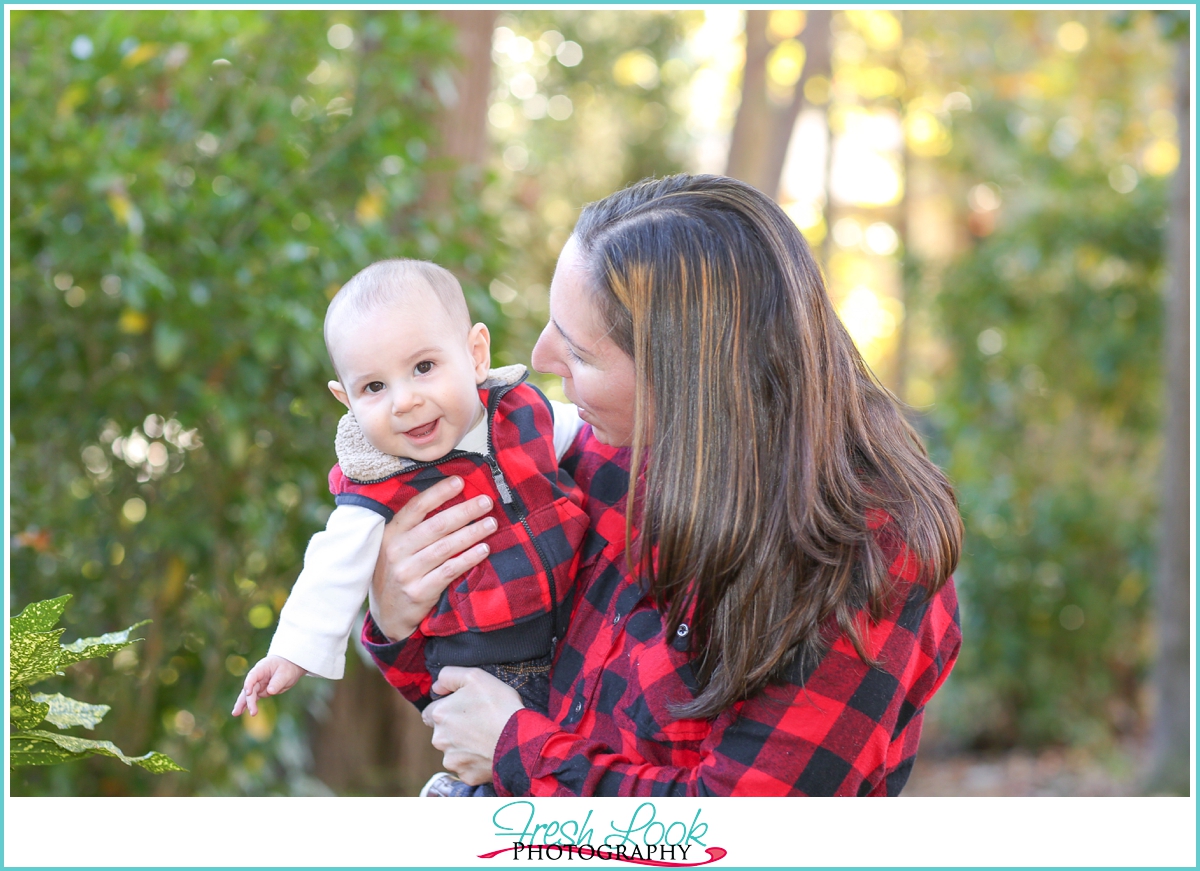 happy baby wearing plaid