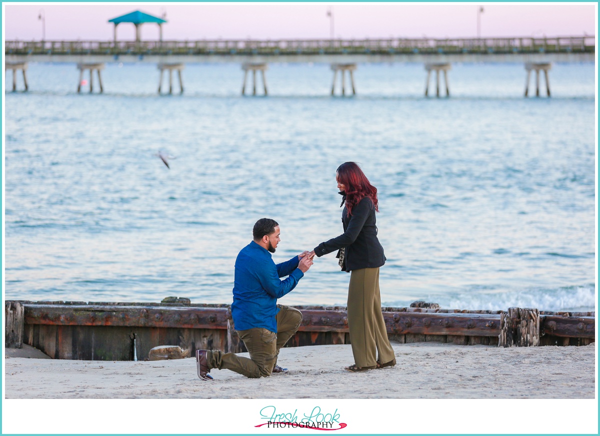 newly engaged couple on the beach