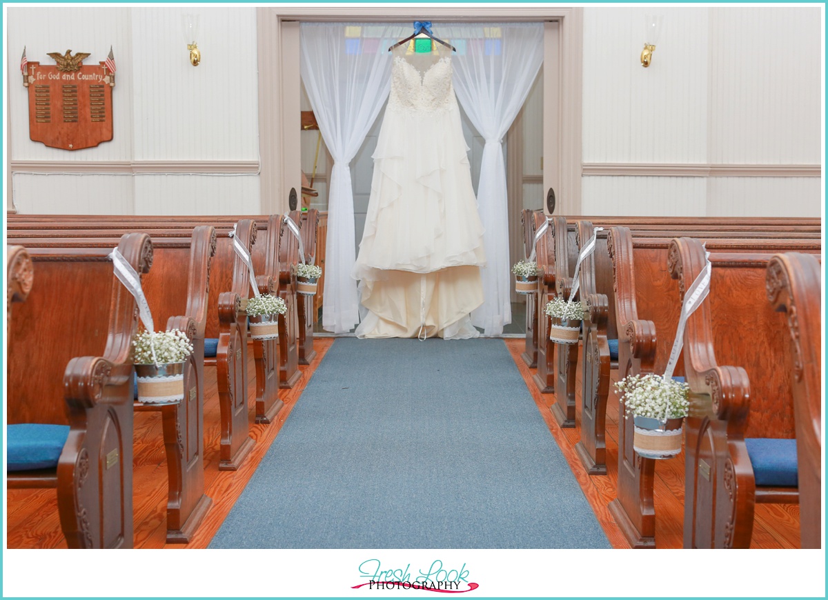 Wedding dress hanging in the church