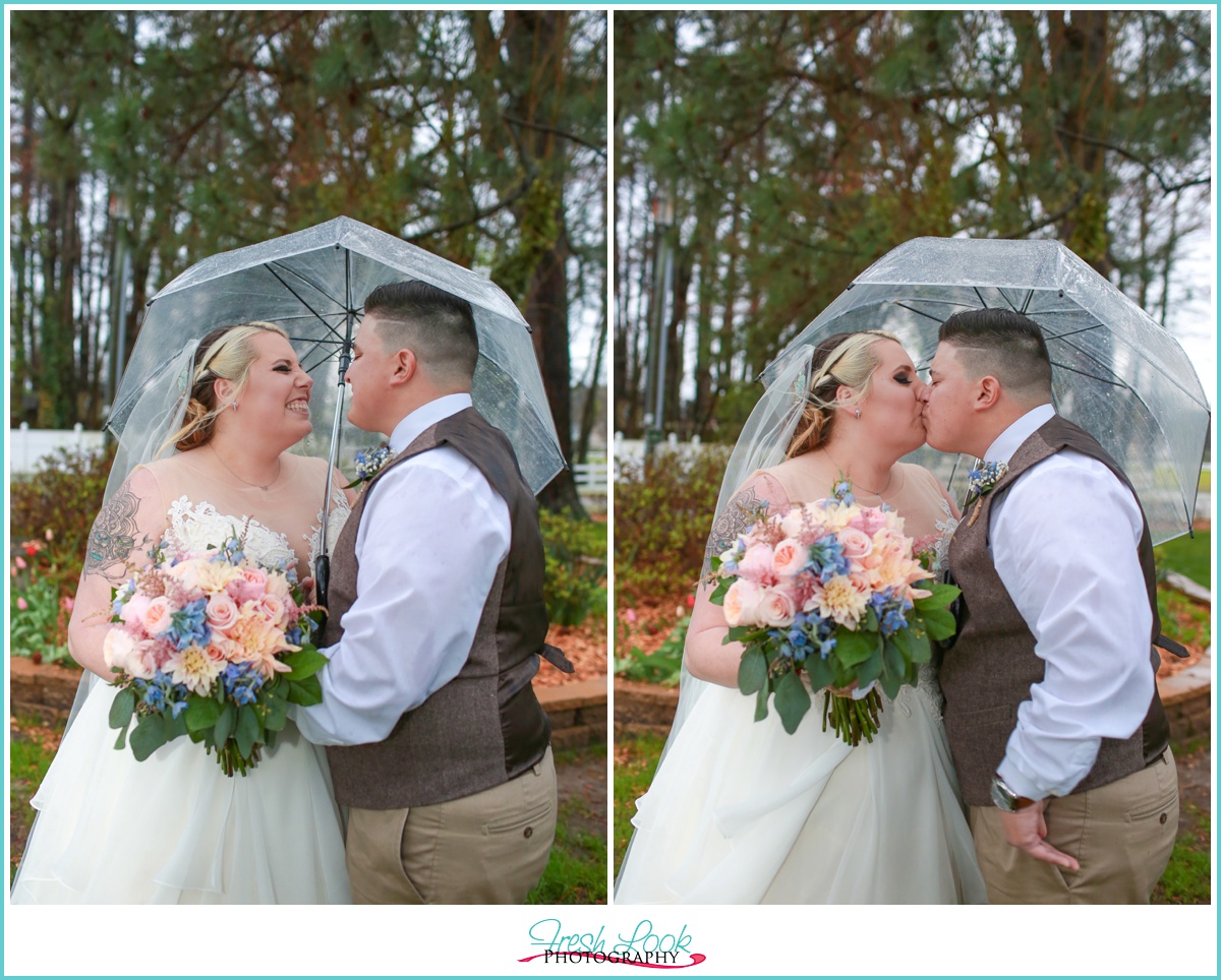 Rainy bride and groom portraits with umbrellas