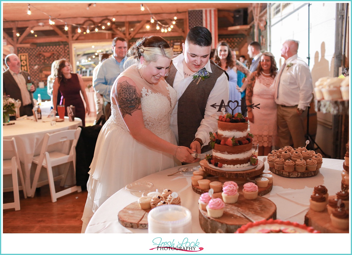 bride and groom cutting cake