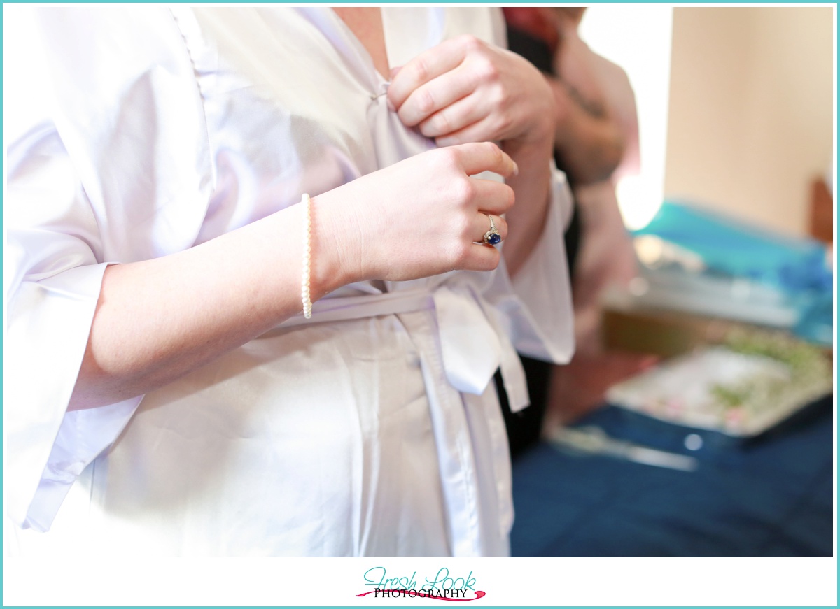 bride wearing wedding robe