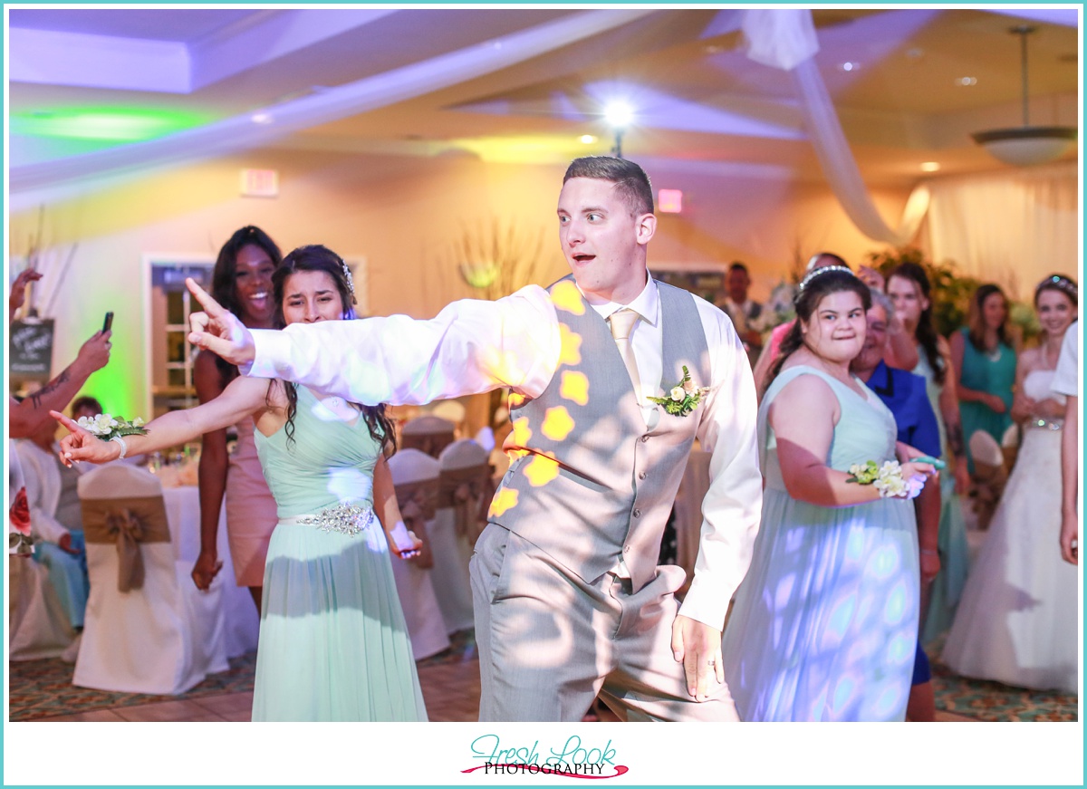 Groom partying at the reception