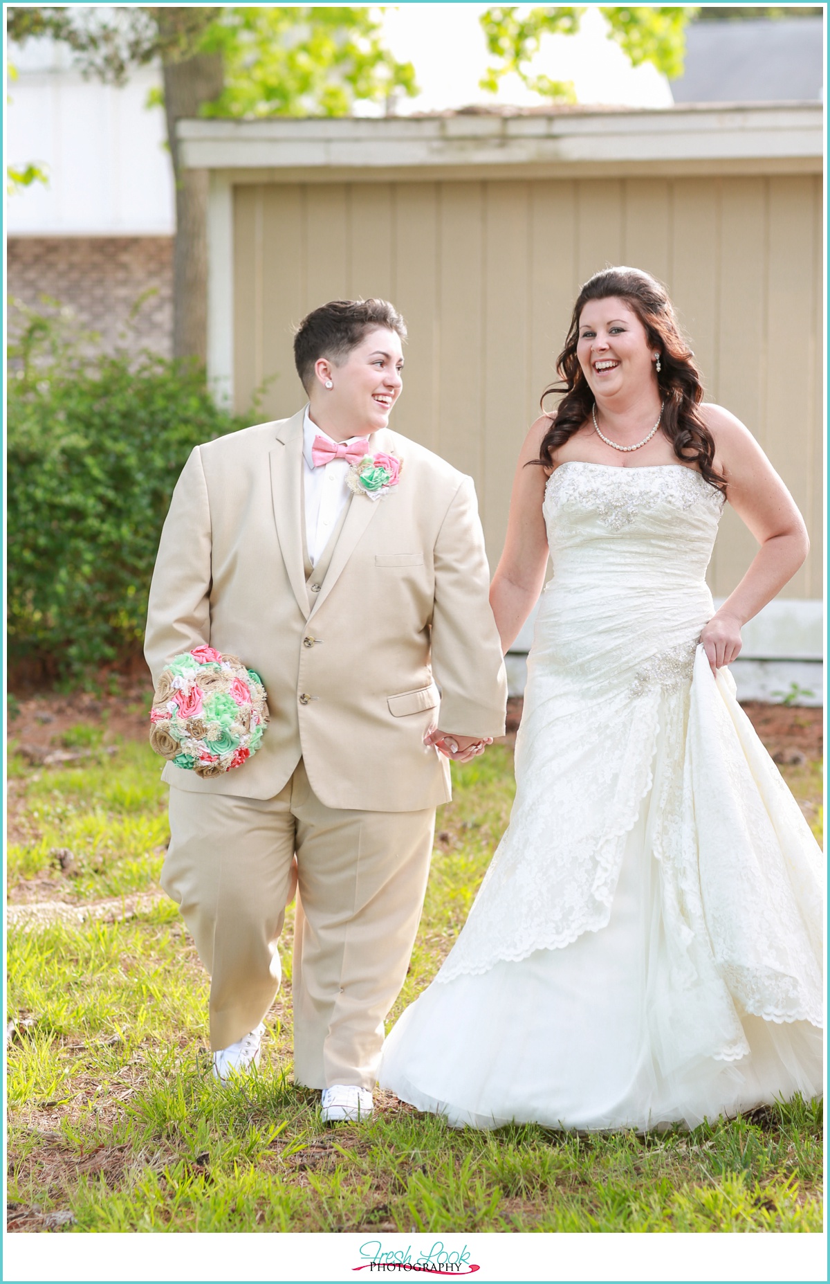 LGBT brides laughing together