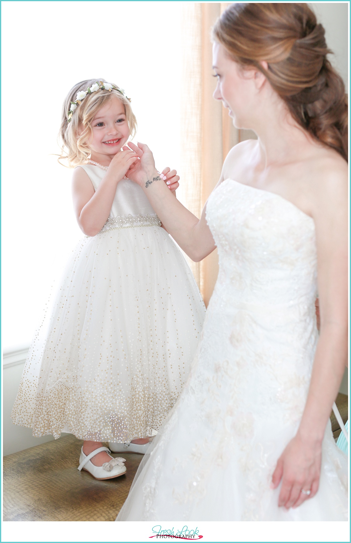 Bride and flower girl getting ready